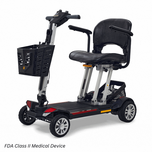 Golden Technologies Buzzaround CarryOn travel power wheelchair in black, showing the center-wheel drive base with front caster wheels and rear support wheels on a white background.